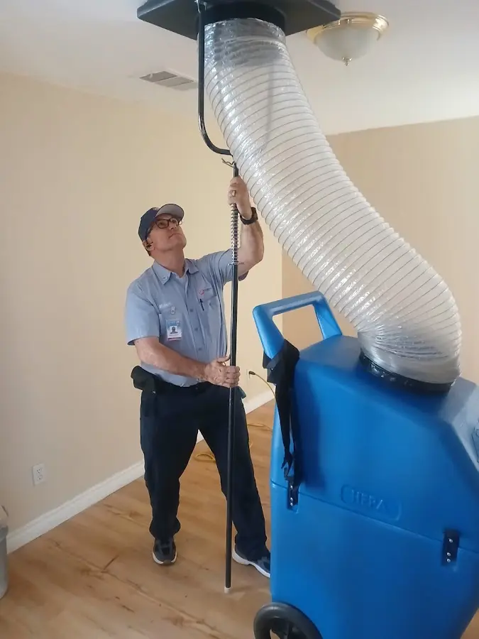 Furnace Tune-Up technician using HEPA equipment in Homewood